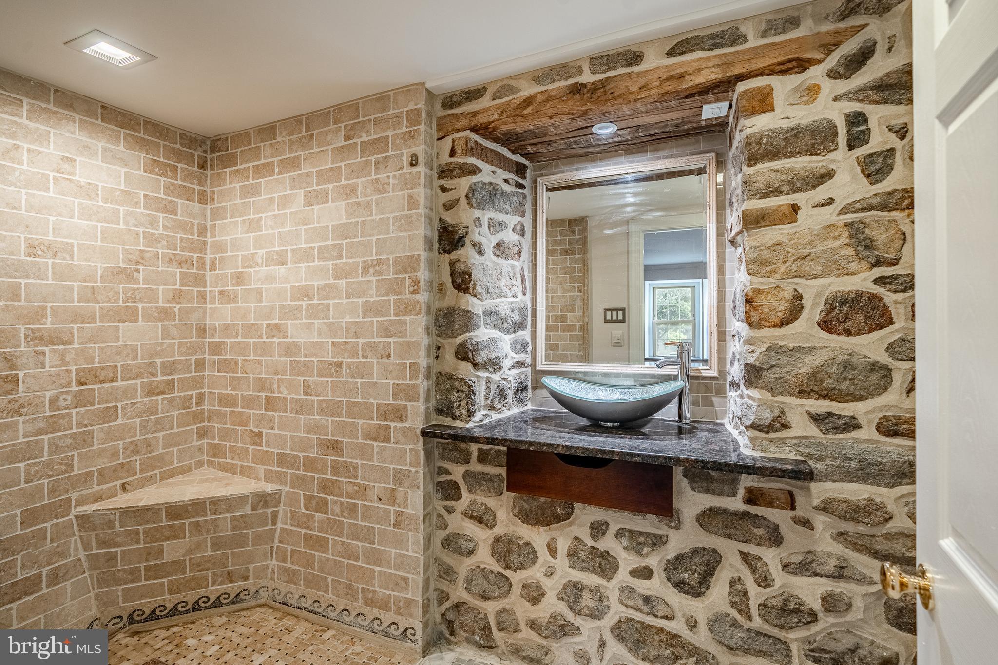 59 East Main Street Elverson, PA 19520 - Photo 26 of 43 a bathroom with a granite countertop shower and a sink