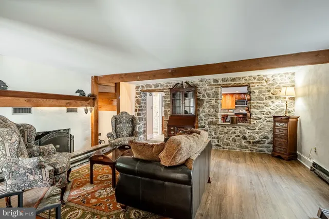 a living room with furniture and large windows