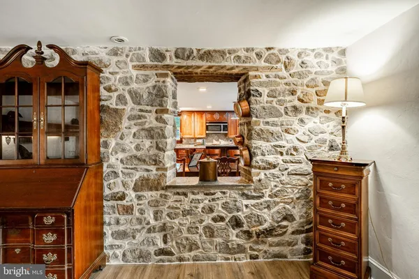 walk in closet with wooden floor