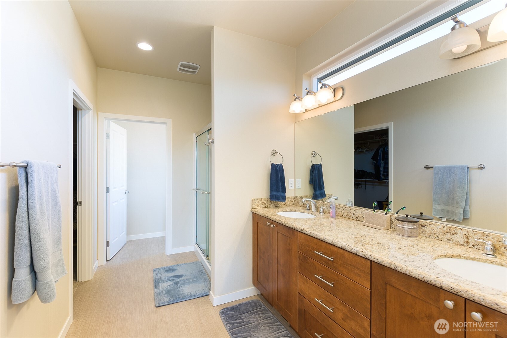 271 Blue Glacier Loop Sequim, WA 98382 - Photo 24 of 39 a bathroom with a granite countertop double vanity sink and mirror