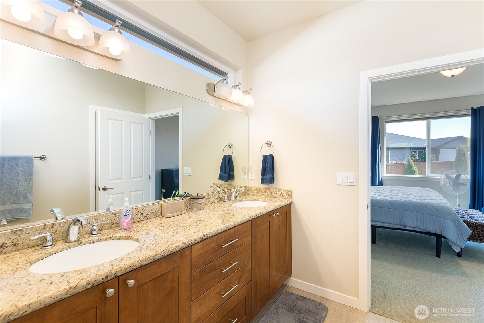 271 Blue Glacier Loop Sequim, WA 98382 - Photo 25 of 39 a en suite bathroom with a granite countertop sink and a mirror