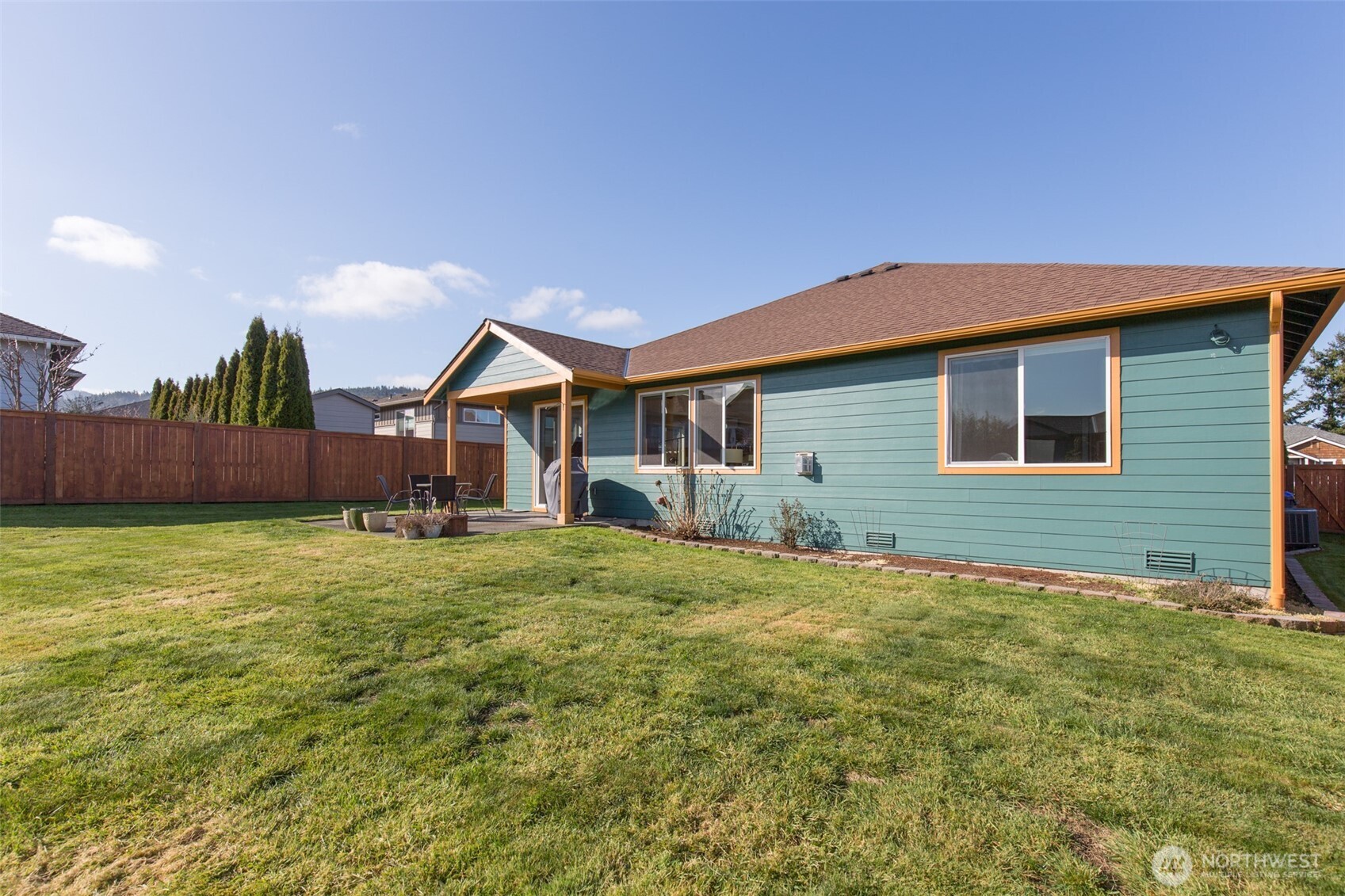 271 Blue Glacier Loop Sequim, WA 98382 - Photo 31 of 39 a view of a house with a yard and a wooden fence