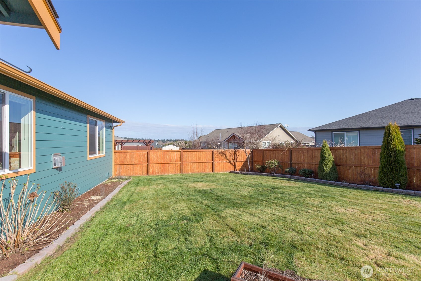 271 Blue Glacier Loop Sequim, WA 98382 - Photo 34 of 39 a view of a house with a yard and garage