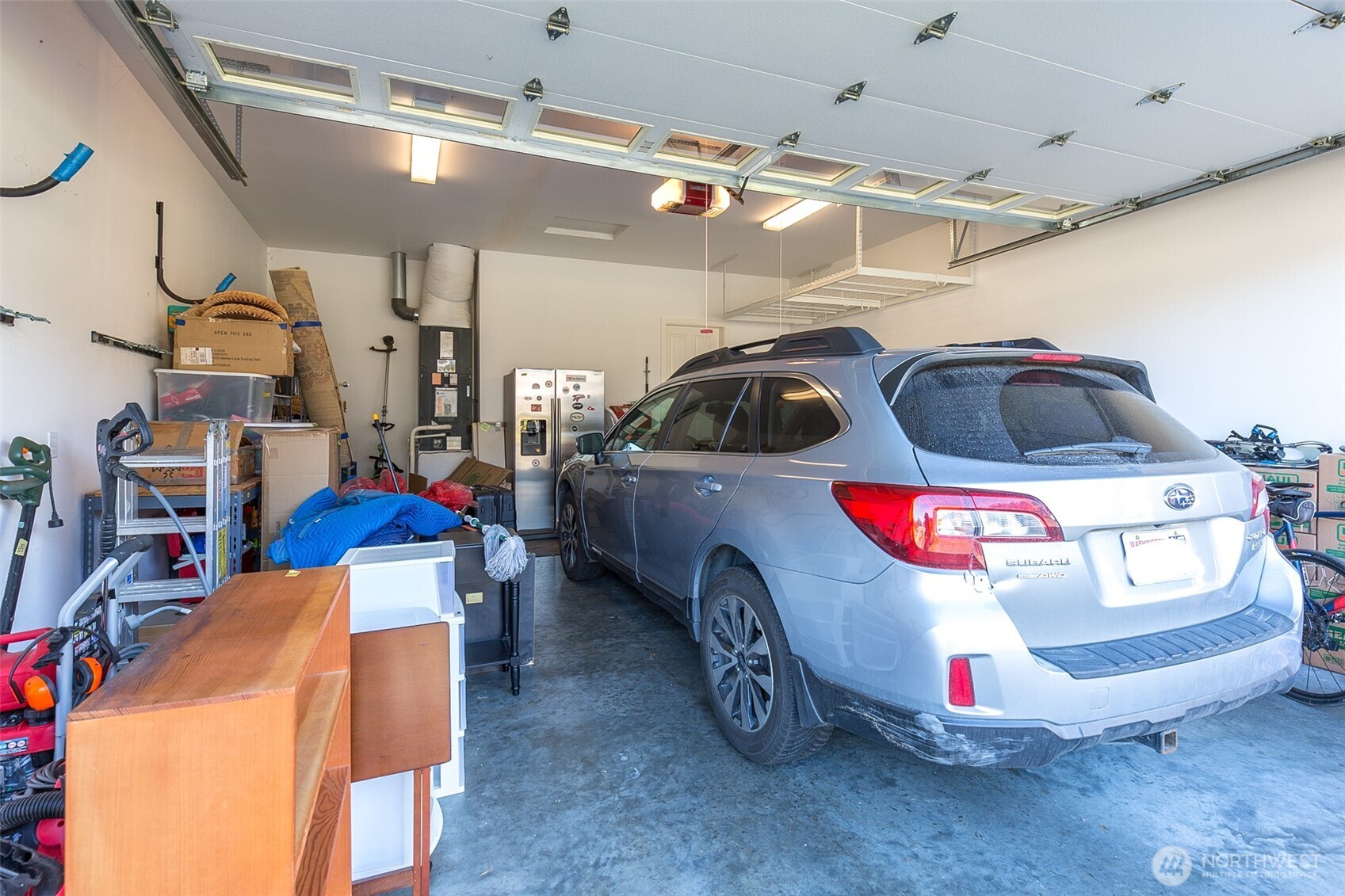 271 Blue Glacier Loop Sequim, WA 98382 - Photo 36 of 39 a car parked in a garage