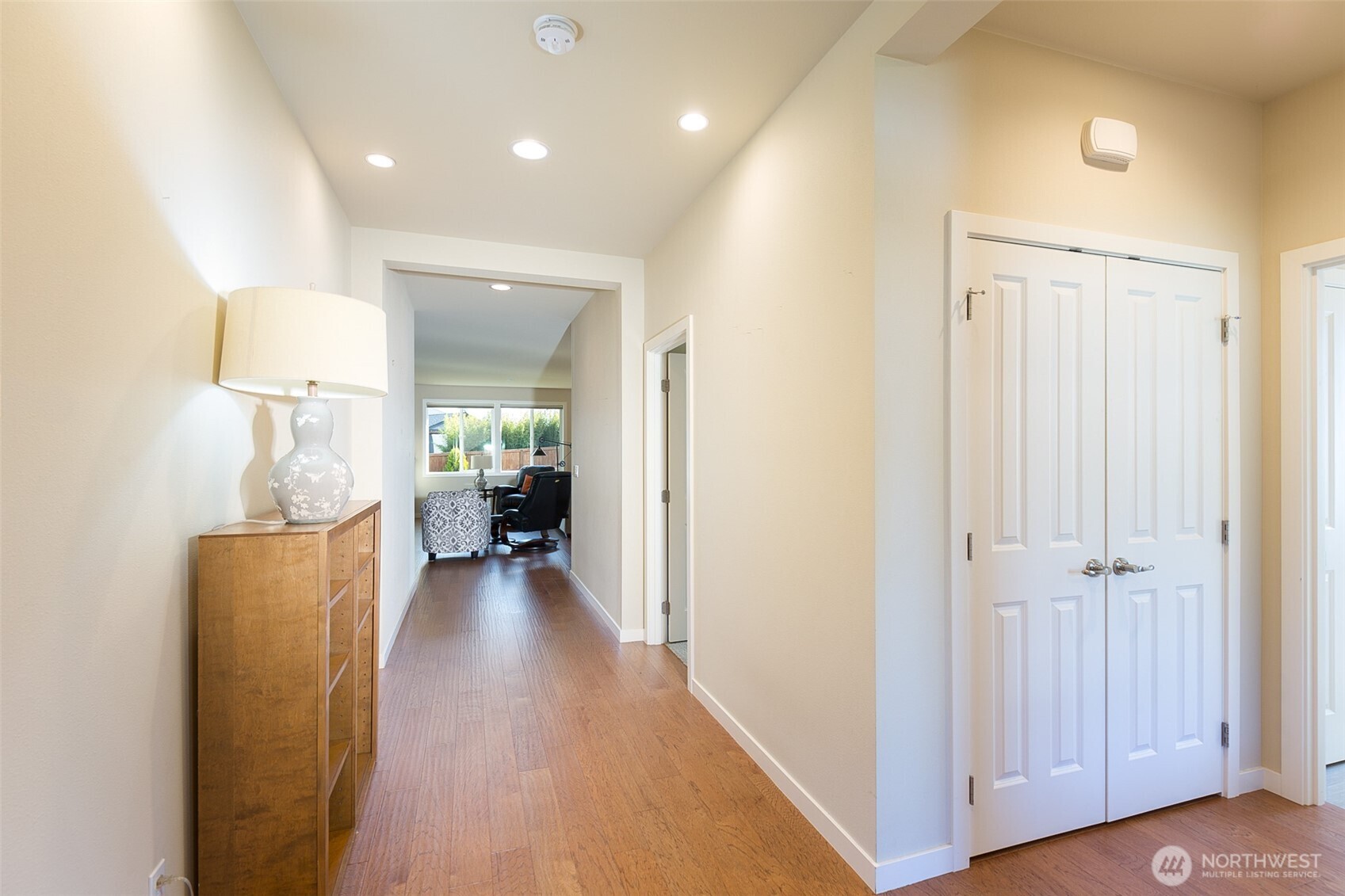 271 Blue Glacier Loop Sequim, WA 98382 - Photo 7 of 39 a view of a hallway with wooden floor windows and a livingroom