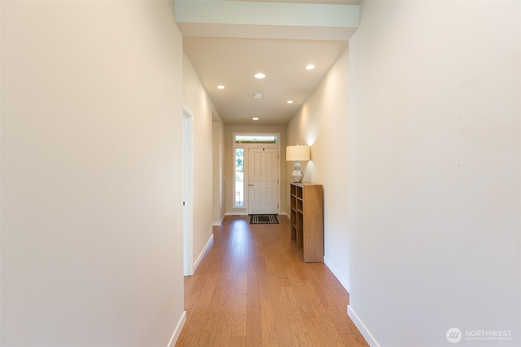 271 Blue Glacier Loop Sequim, WA 98382 - Photo 8 of 39 a view of a hallway with wooden floor