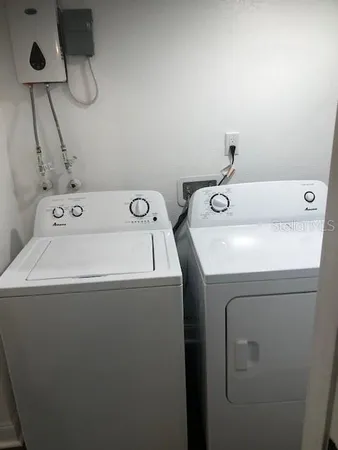 a bathroom with a toilet and a bath tub