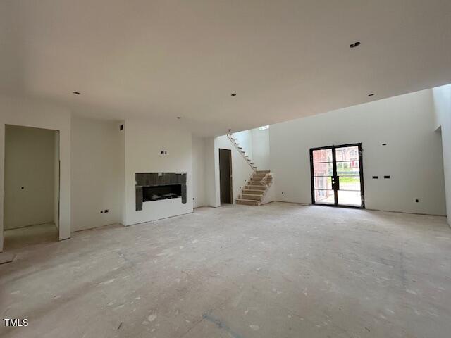 1500 Ridge Road Raleigh, NC 27607 - Photo 6 of 36 a view of an empty room with a fireplace and a window