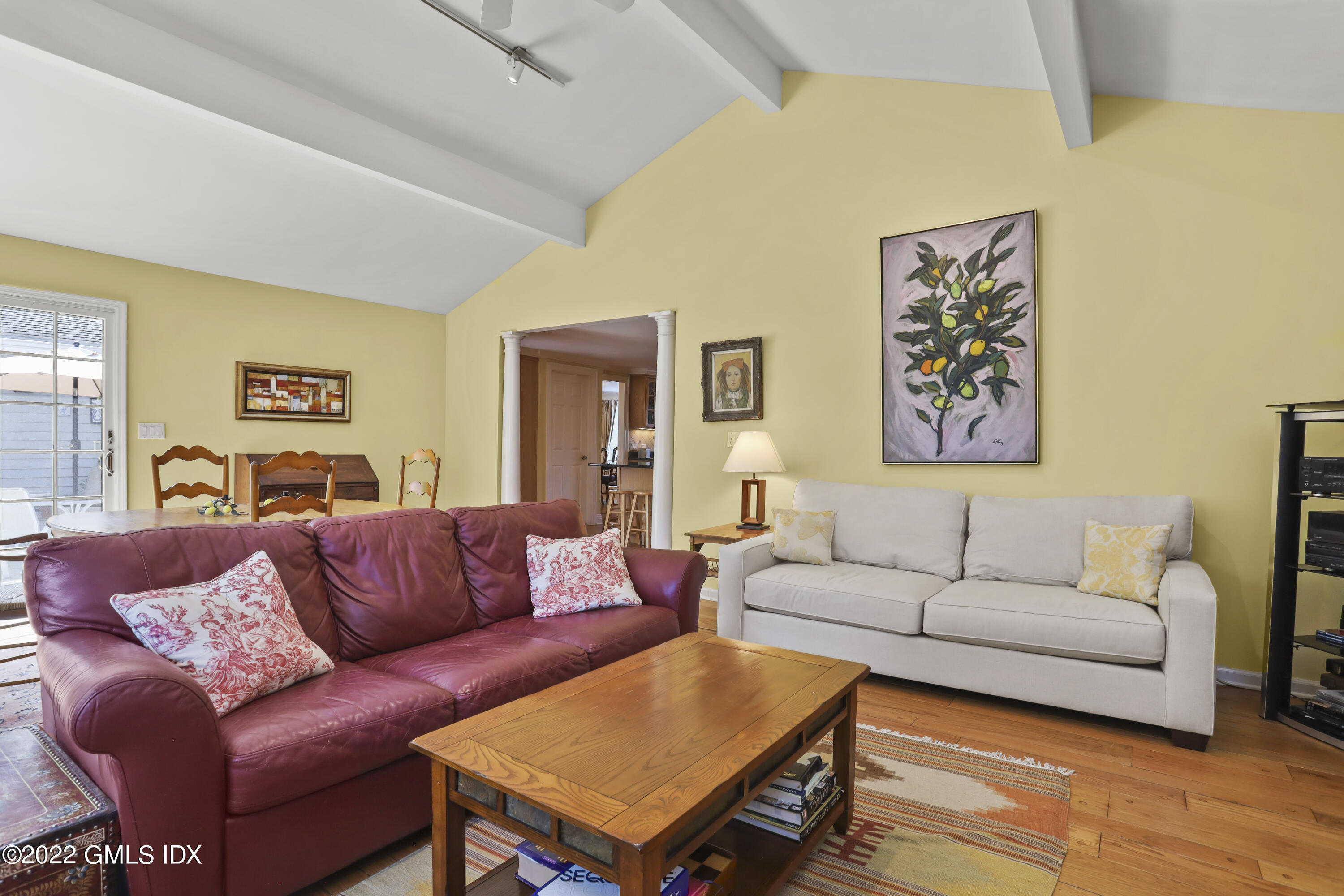 90 Carter Drive Stamford, CT 06902 - Photo 13 of 40 a living room with furniture a couch and paintings on the wall