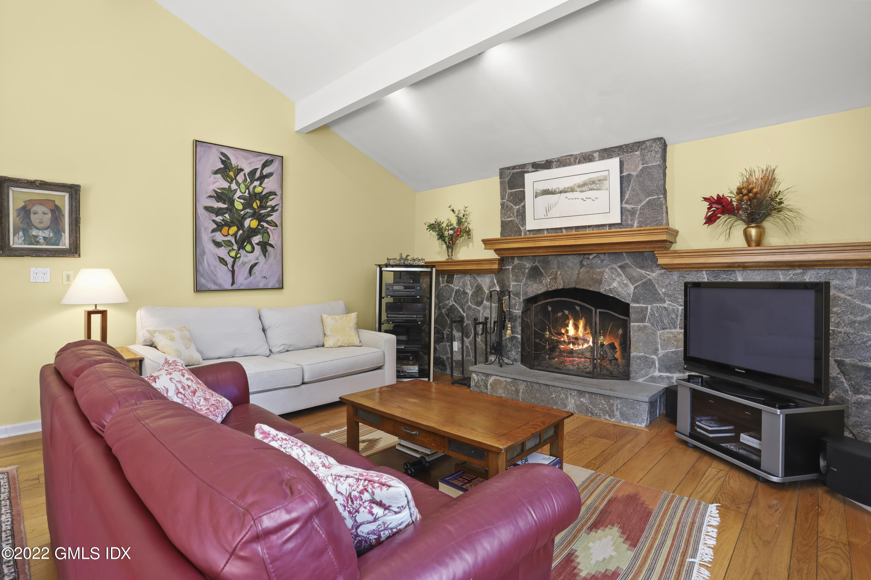 90 Carter Drive Stamford, CT 06902 - Photo 14 of 40 a living room with furniture flat screen tv and a fireplace