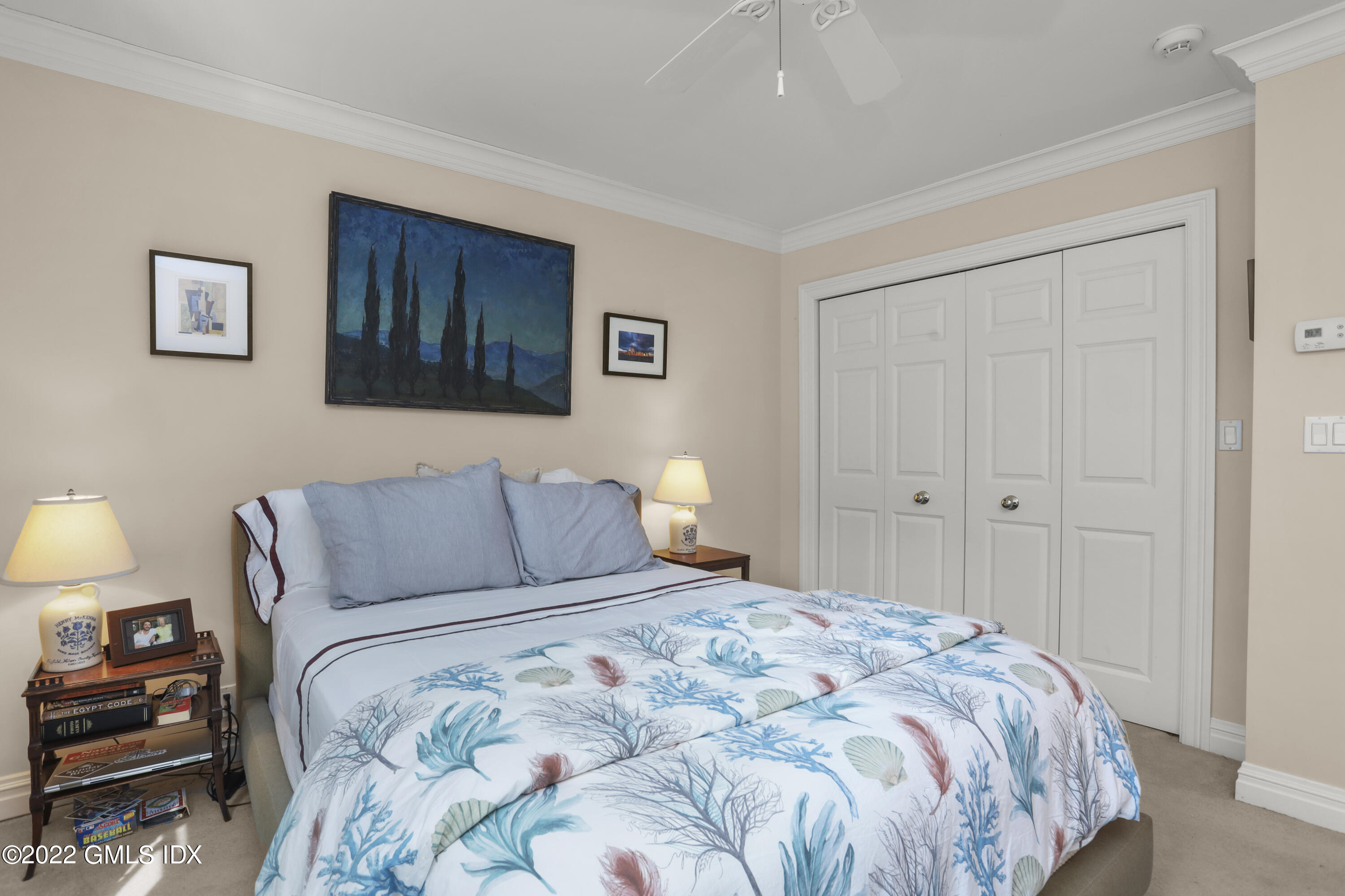 90 Carter Drive Stamford, CT 06902 - Photo 27 of 40 a bedroom with a bed and a lamp