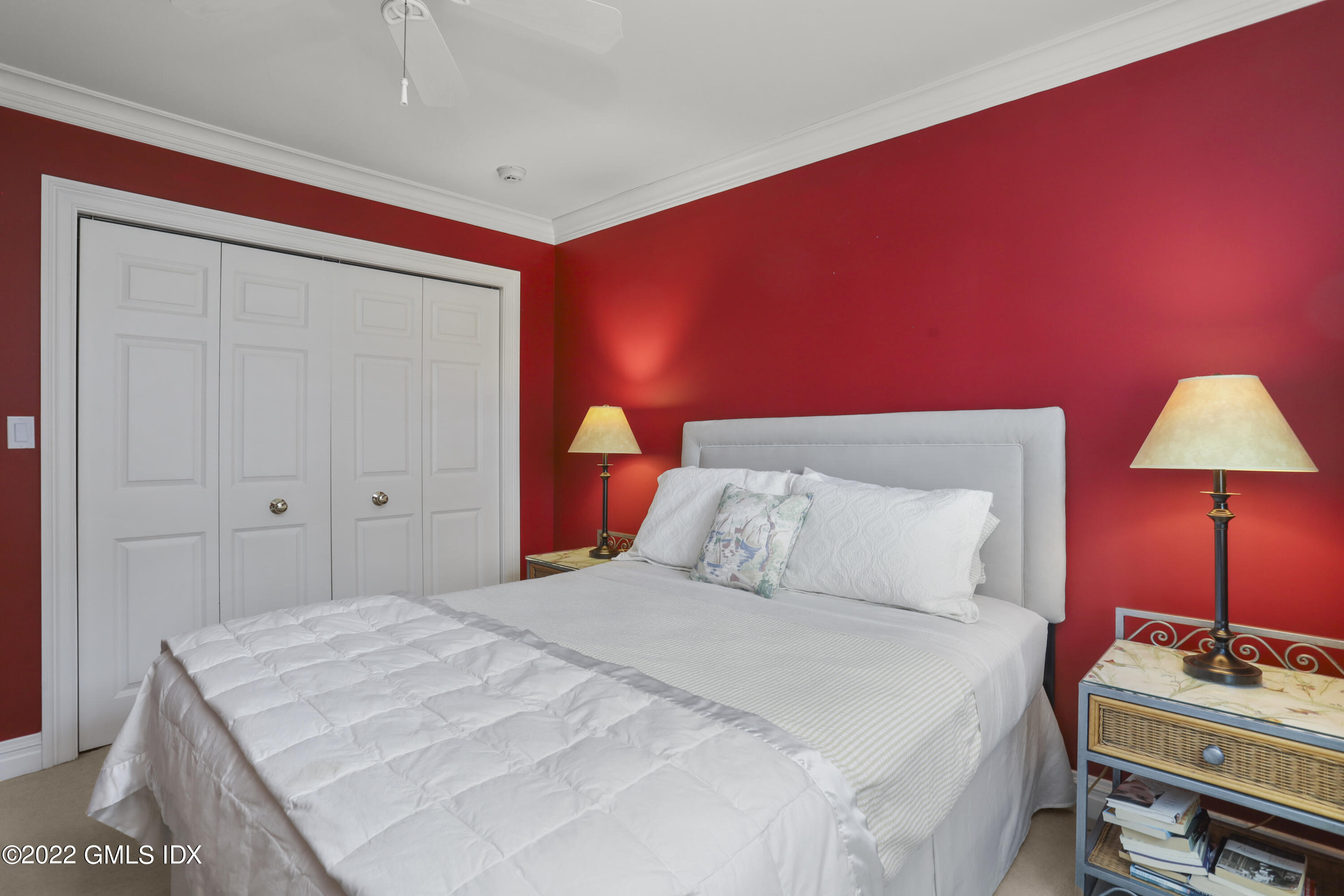 90 Carter Drive Stamford, CT 06902 - Photo 29 of 40 a bedroom with a bed and a lamp