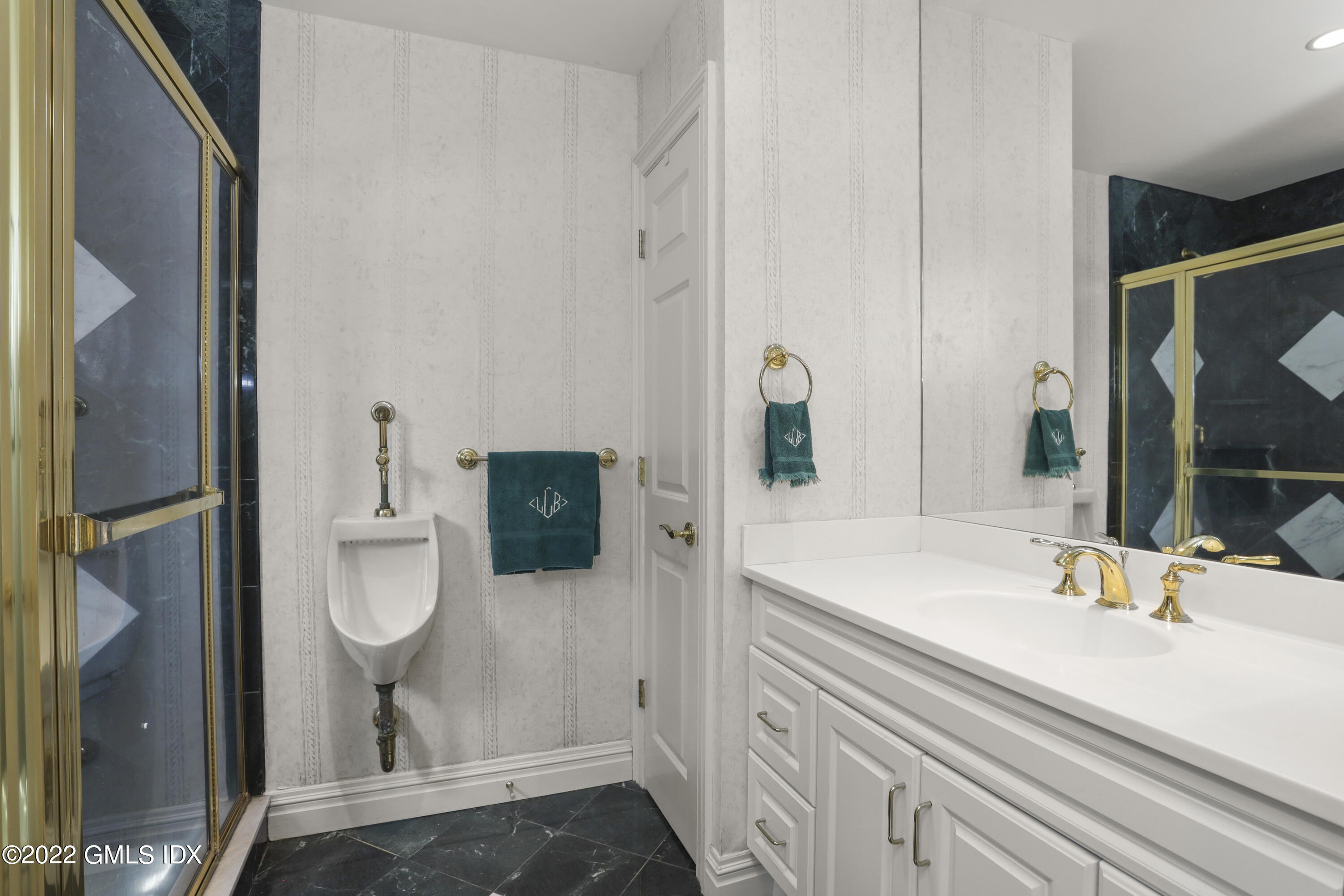 90 Carter Drive Stamford, CT 06902 - Photo 33 of 40 a bathroom with a sink and a mirror