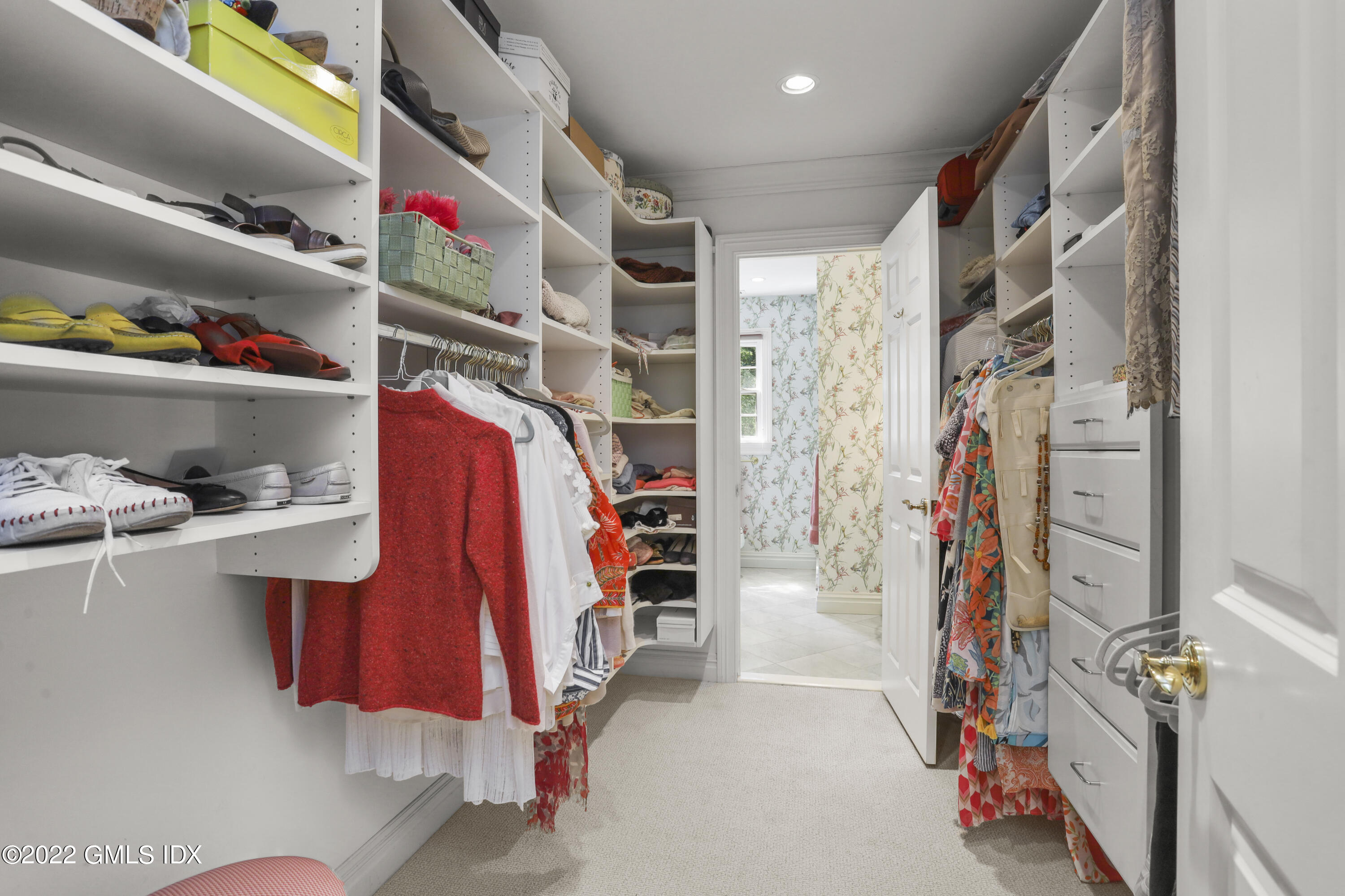 90 Carter Drive Stamford, CT 06902 - Photo 37 of 40 a view of walk in closet with clothes and shoes