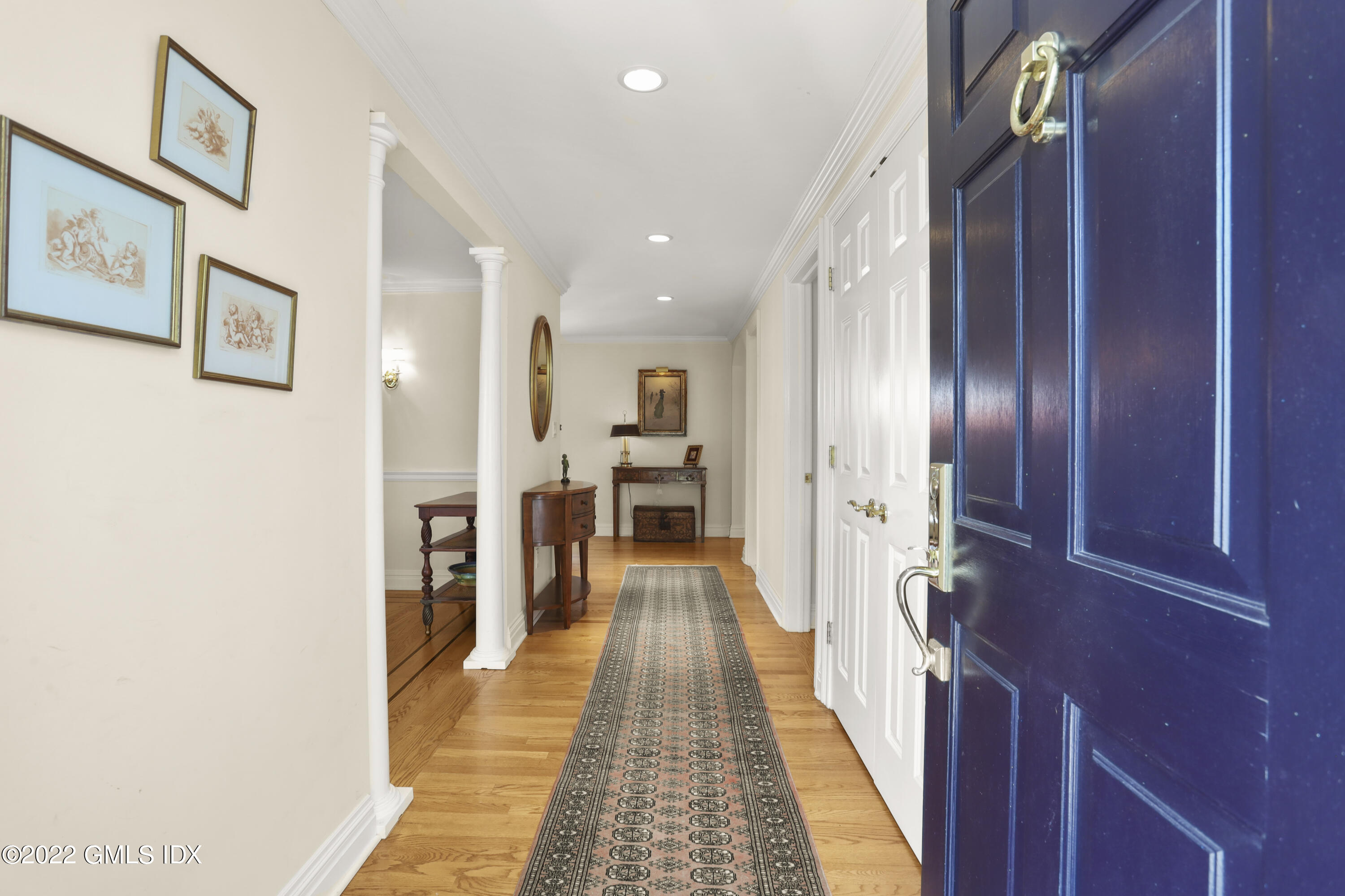 90 Carter Drive Stamford, CT 06902 - Photo 5 of 40 a view of a hallway with wooden floor and staircase