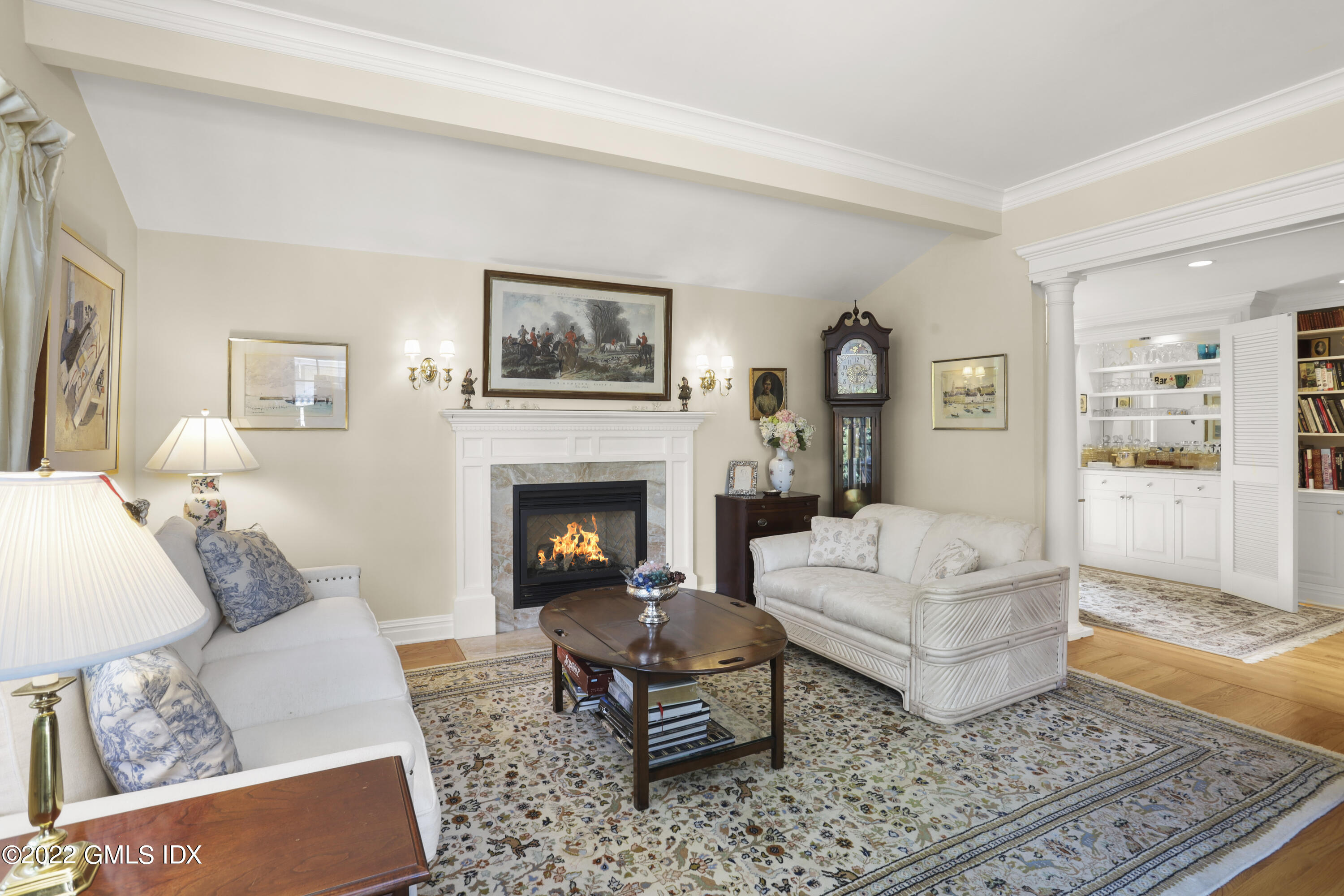 90 Carter Drive Stamford, CT 06902 - Photo 7 of 40 a living room with furniture and a fireplace