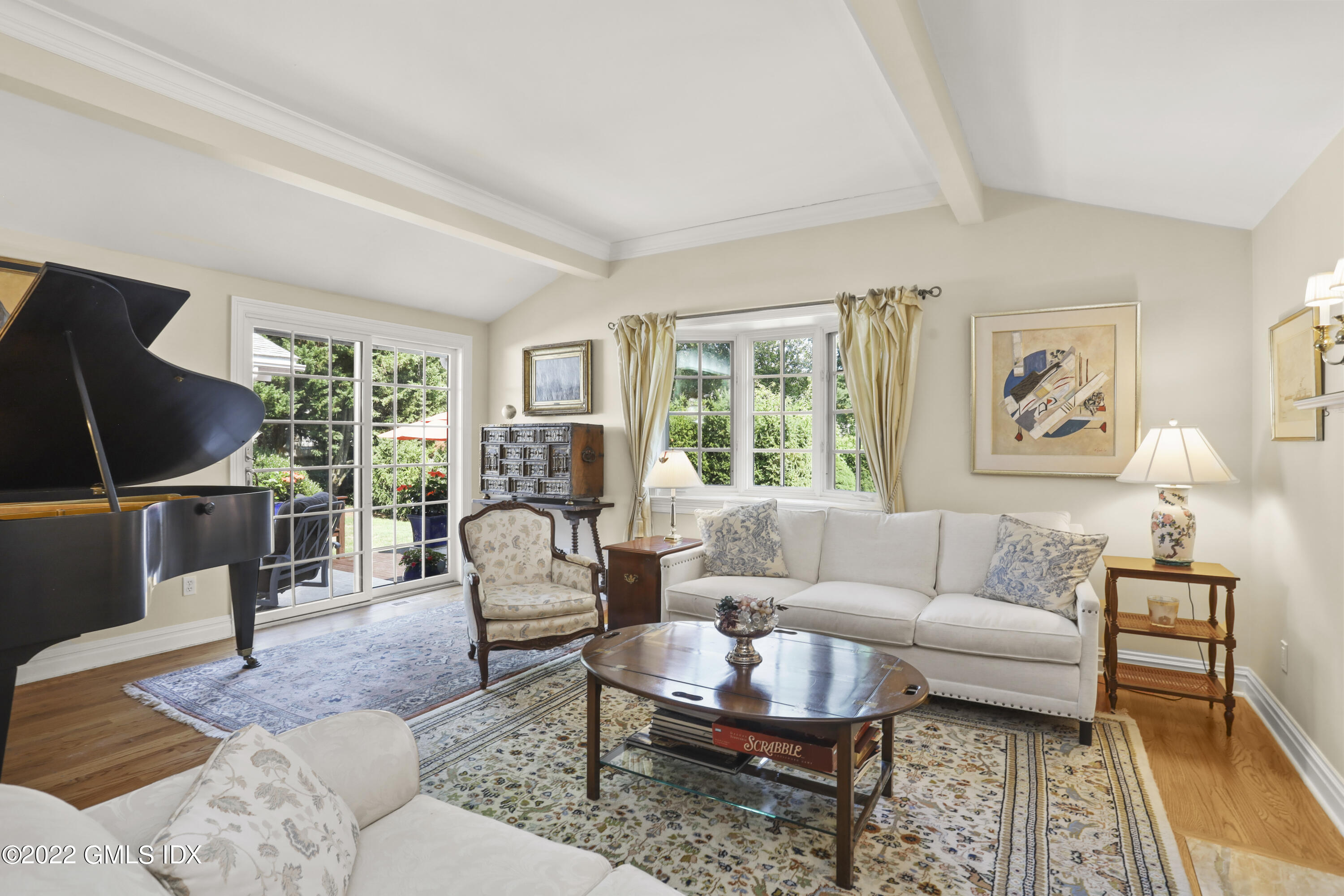 90 Carter Drive Stamford, CT 06902 - Photo 9 of 40 a living room with furniture a rug a lamp and a window