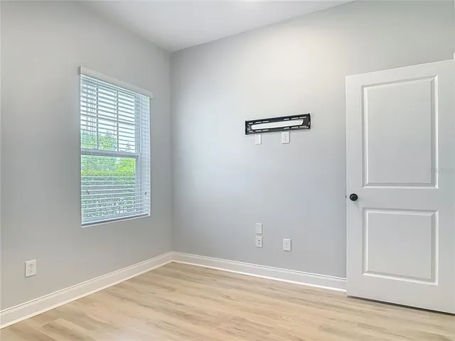 a view of an empty room with a window