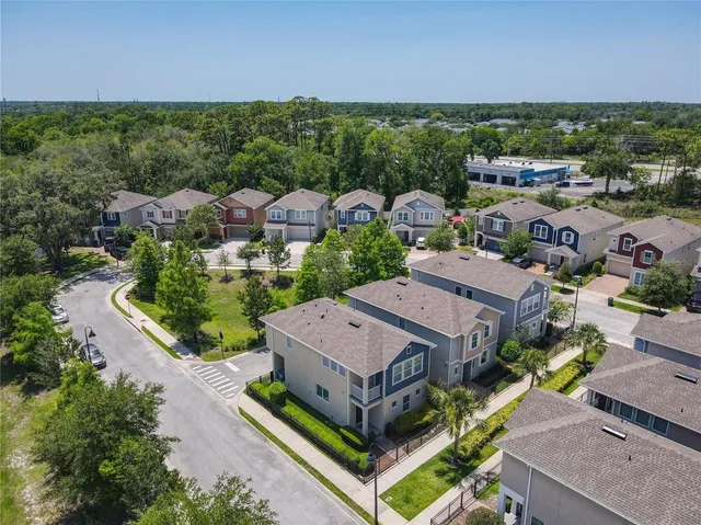 an aerial view of a house with a garden