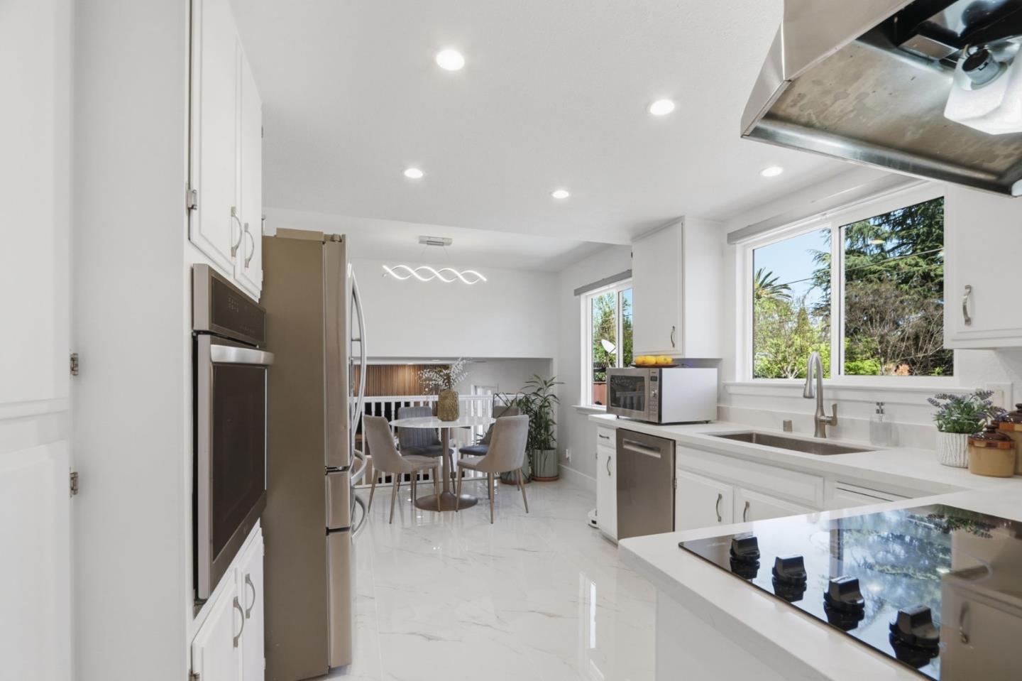 5888 Lean Way San Jose, CA 95123 - Photo 23 of 54 a kitchen with stainless steel appliances kitchen island granite countertop a sink and cabinets