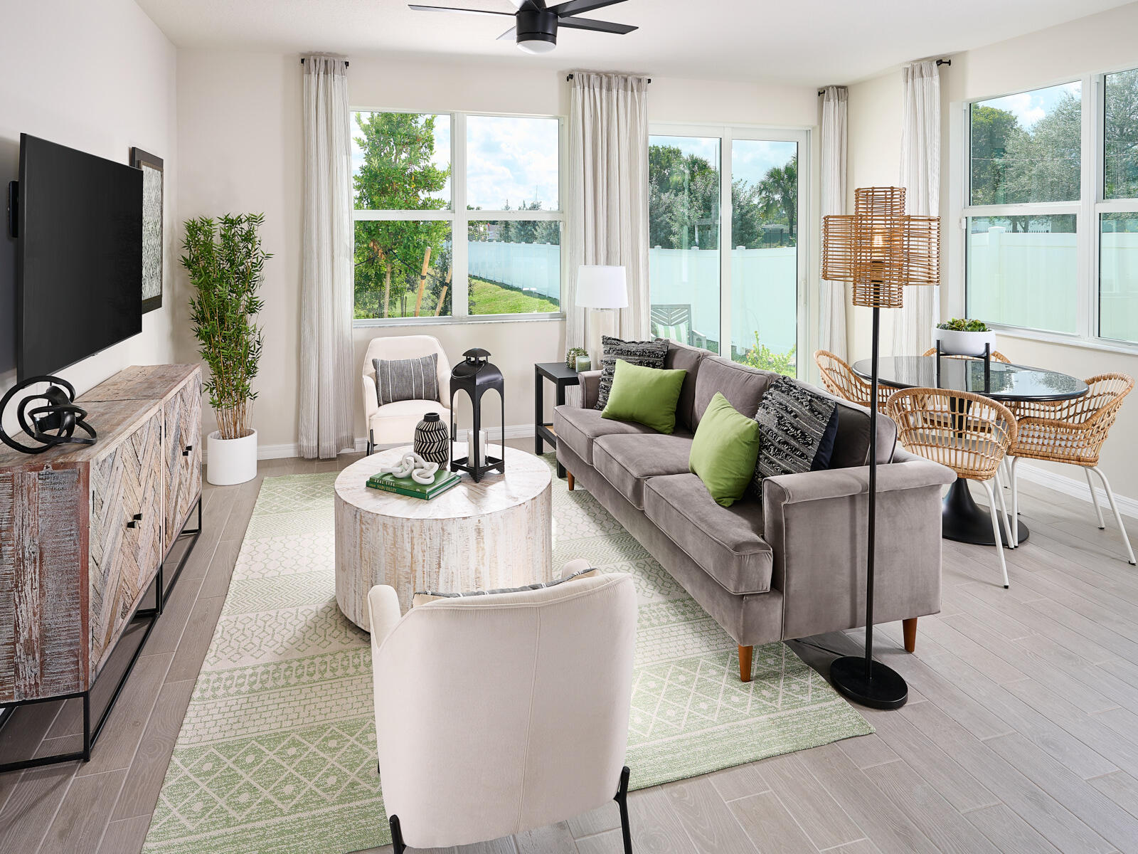 5658 Southeast Edgewater Circle Stuart, FL 34997 - Photo 3 of 8 a living room with furniture and a flat screen tv