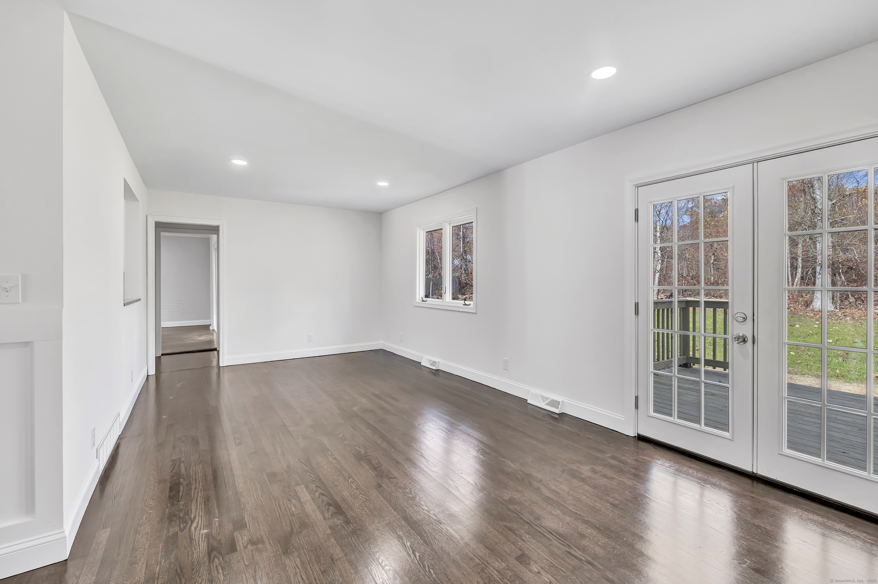 159 Tom Swamp Road Hamden, CT 06518 - Photo 15 of 38 a view of an empty room with wooden floor and a window