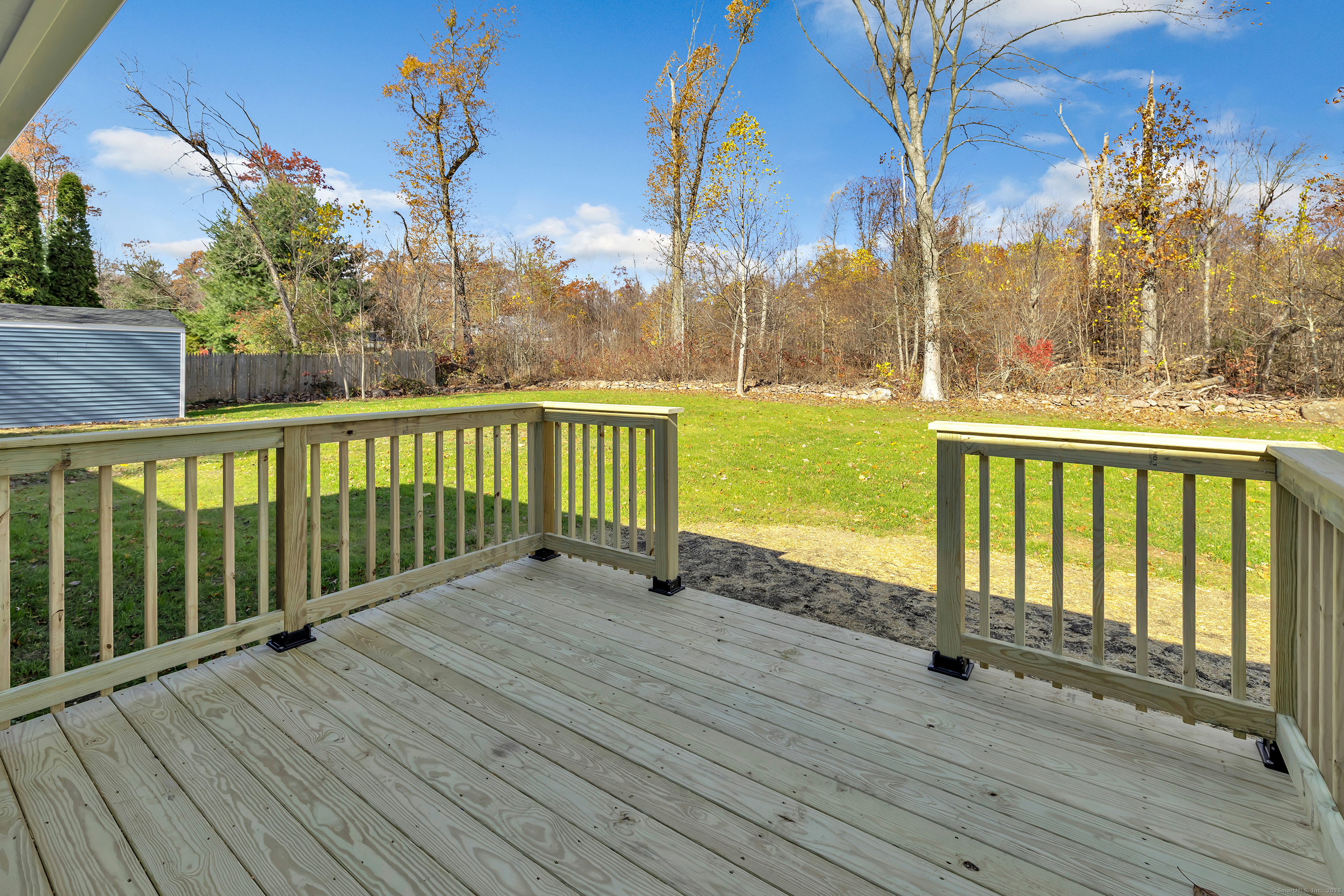 159 Tom Swamp Road Hamden, CT 06518 - Photo 32 of 38 a view of wooden deck and a garden