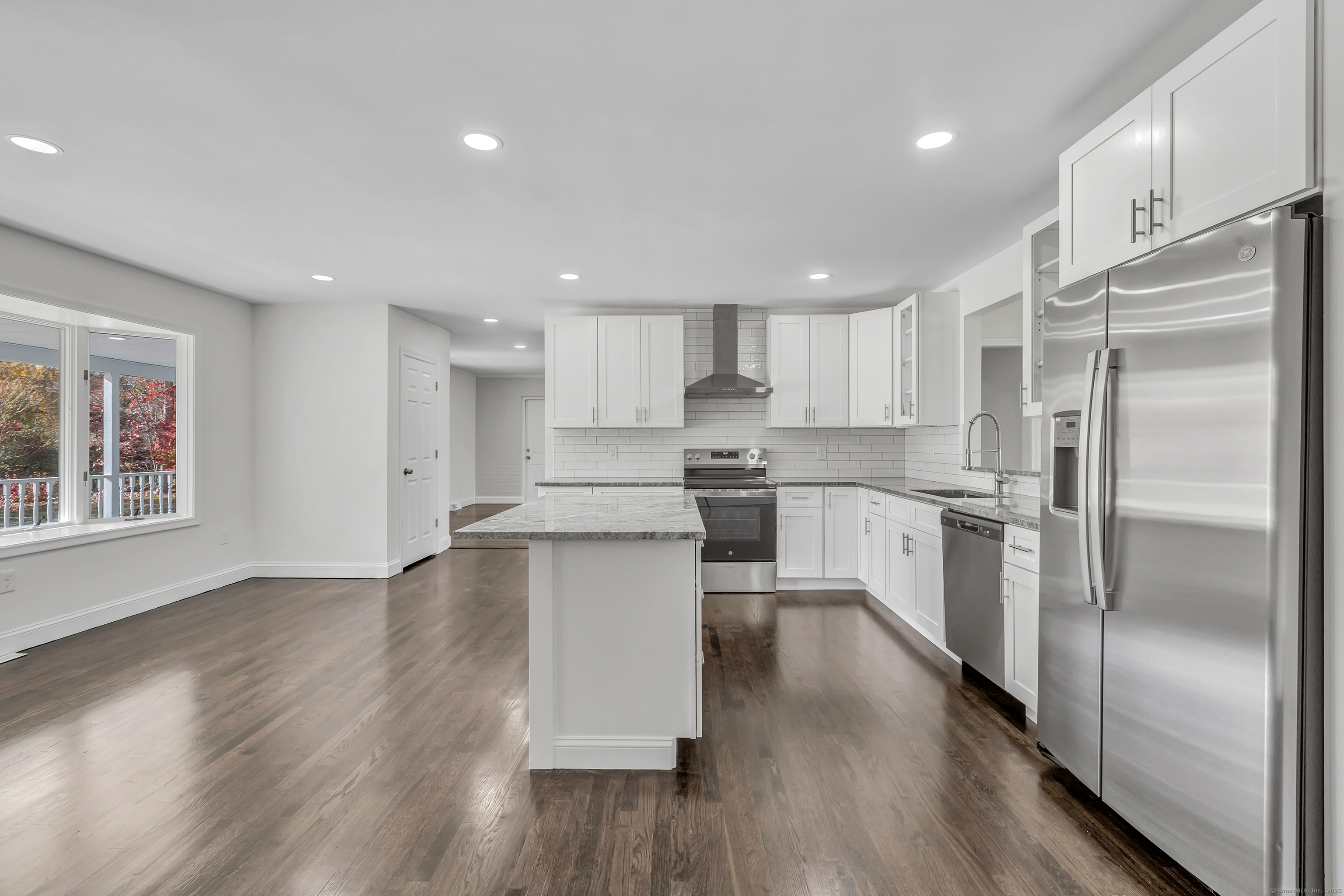159 Tom Swamp Road Hamden, CT 06518 - Photo 5 of 38 a kitchen with a refrigerator and a sink