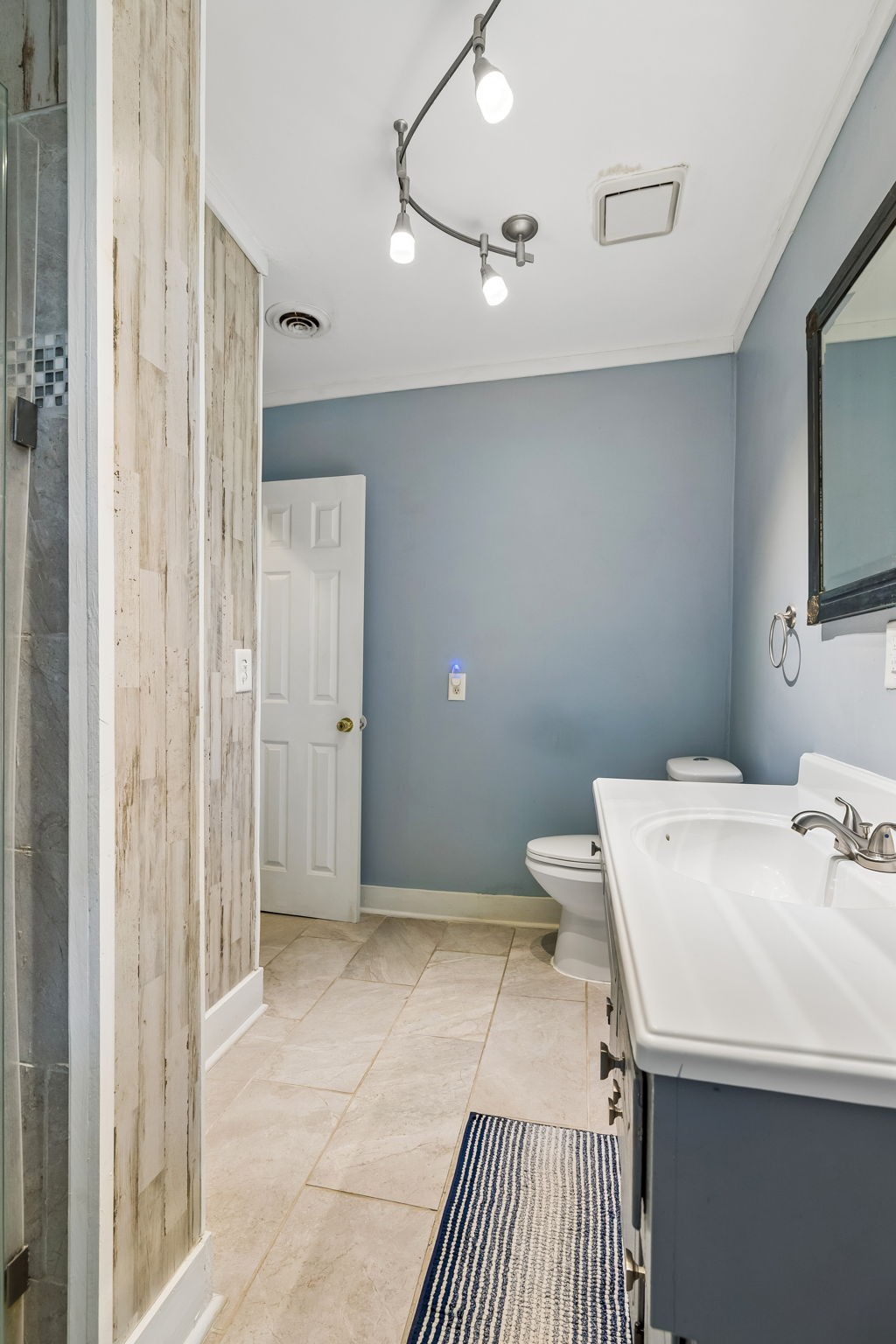 313 Cullum Street Carthage, TN 37030 - Photo 24 of 60 a bathroom with a sink a toilet and shower