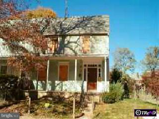 1547 Minnesota Road Camden, NJ 08104 - Photo 1 of 1 a view of a house with a tree in the background