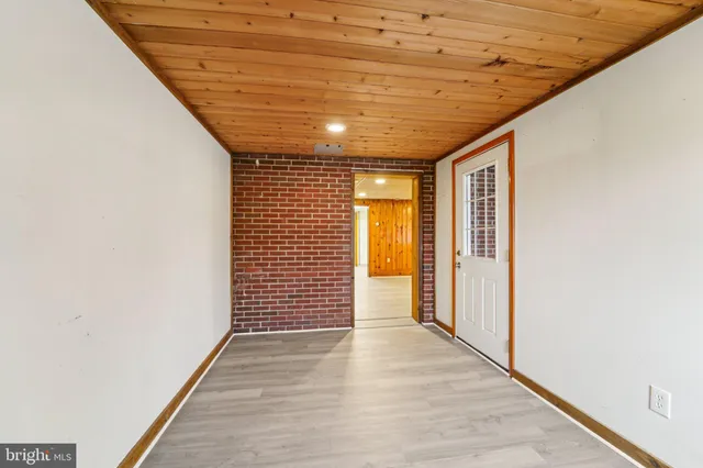 a view of hallway with wooden floor