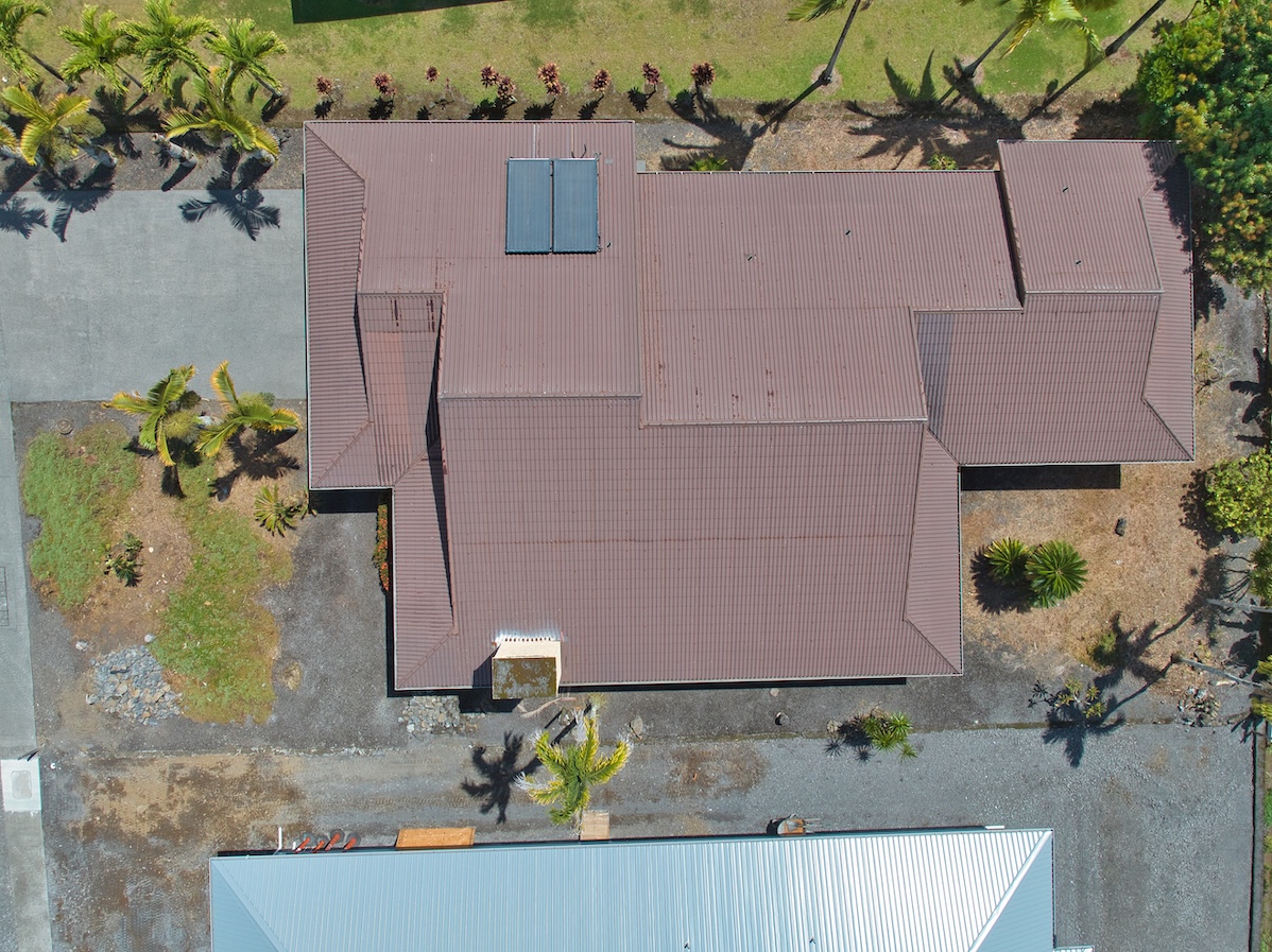 708 Kukuau Street Hilo, HI 96720 - Photo 18 of 18 with white house with a flower garden