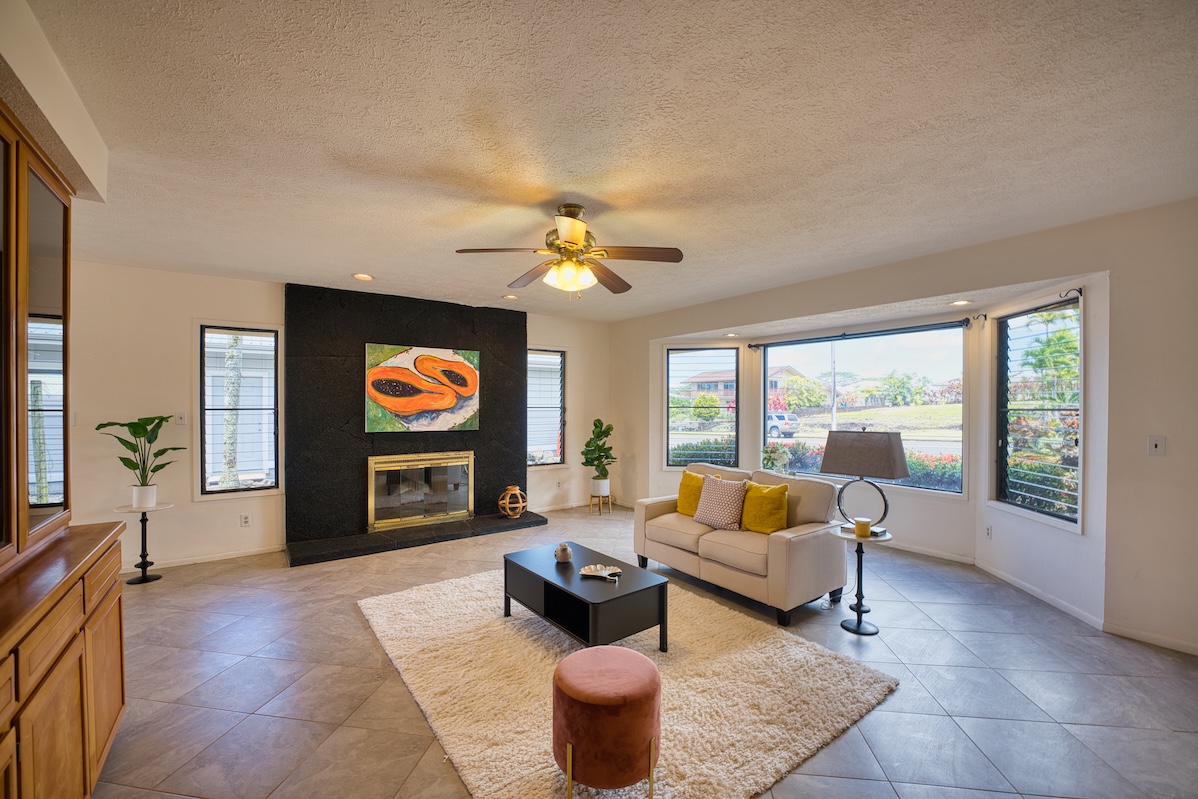 708 Kukuau Street Hilo, HI 96720 - Photo 3 of 18 a living room with furniture and a flat screen tv