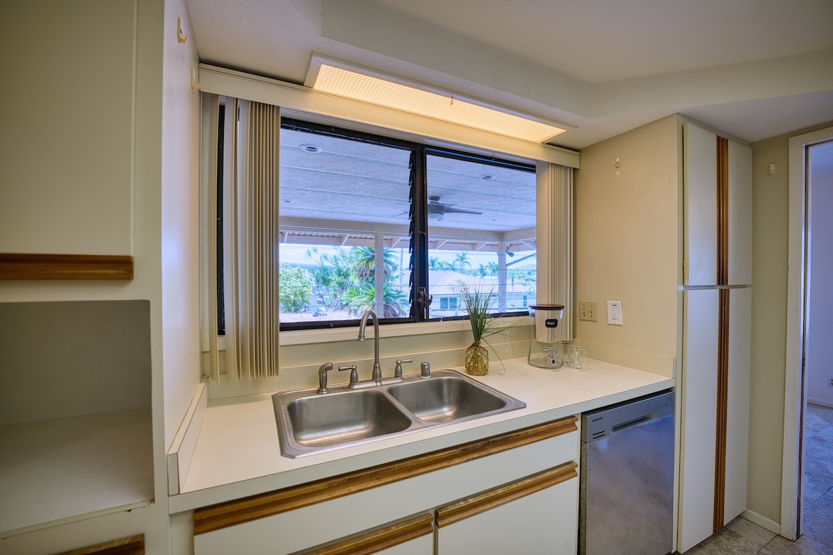 708 Kukuau Street Hilo, HI 96720 - Photo 9 of 18 a kitchen with a sink and a large window