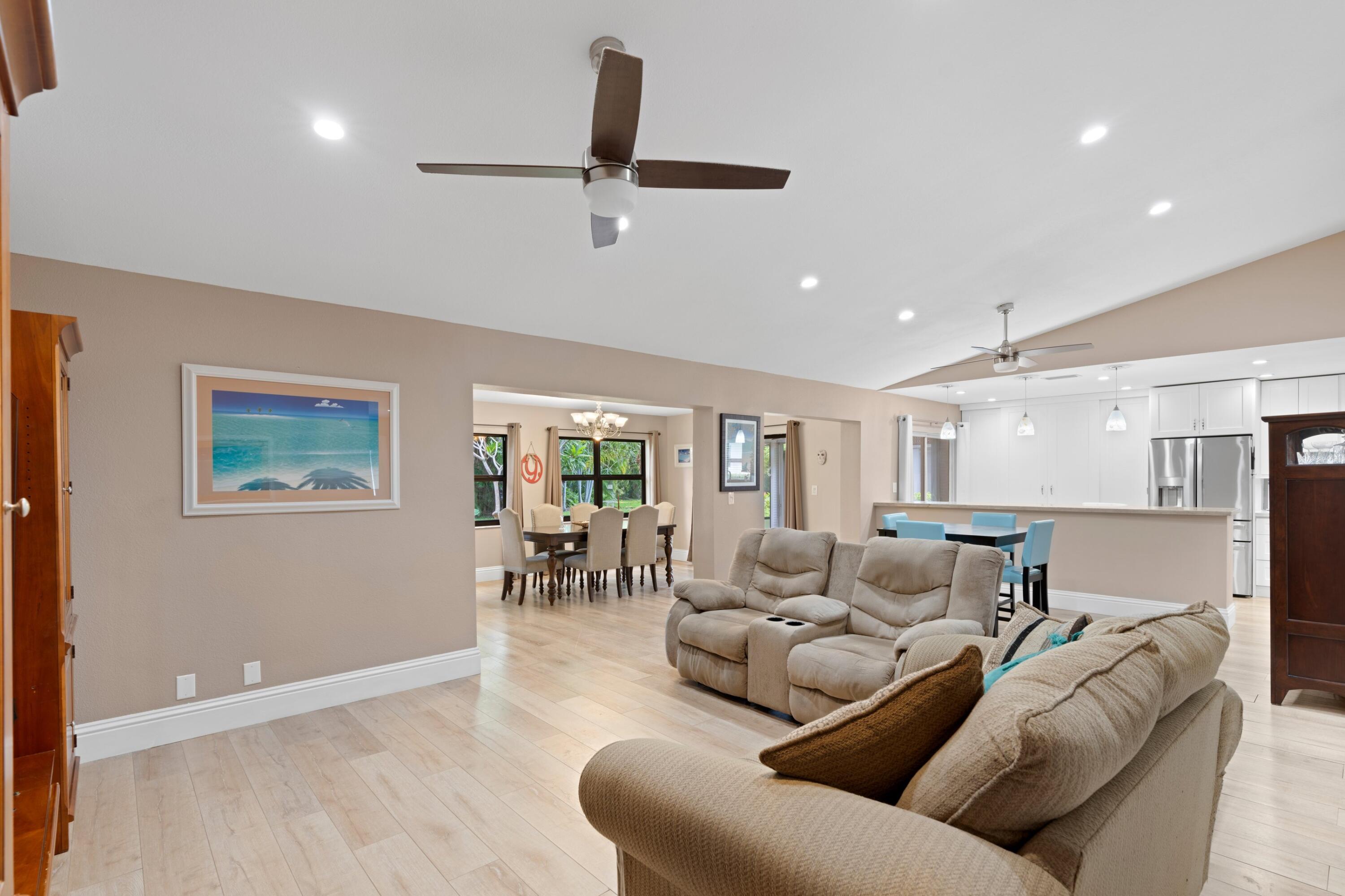 7980 Cloverfield Circle Boca Raton, FL 33433 - Photo 11 of 44 a living room with furniture and a large window