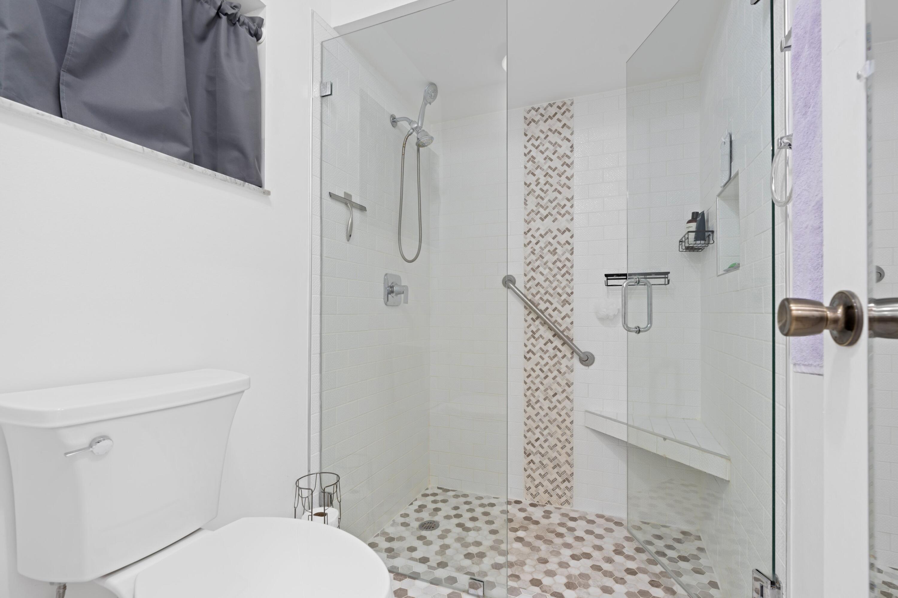 7980 Cloverfield Circle Boca Raton, FL 33433 - Photo 15 of 44 a bathroom with a toilet and a shower