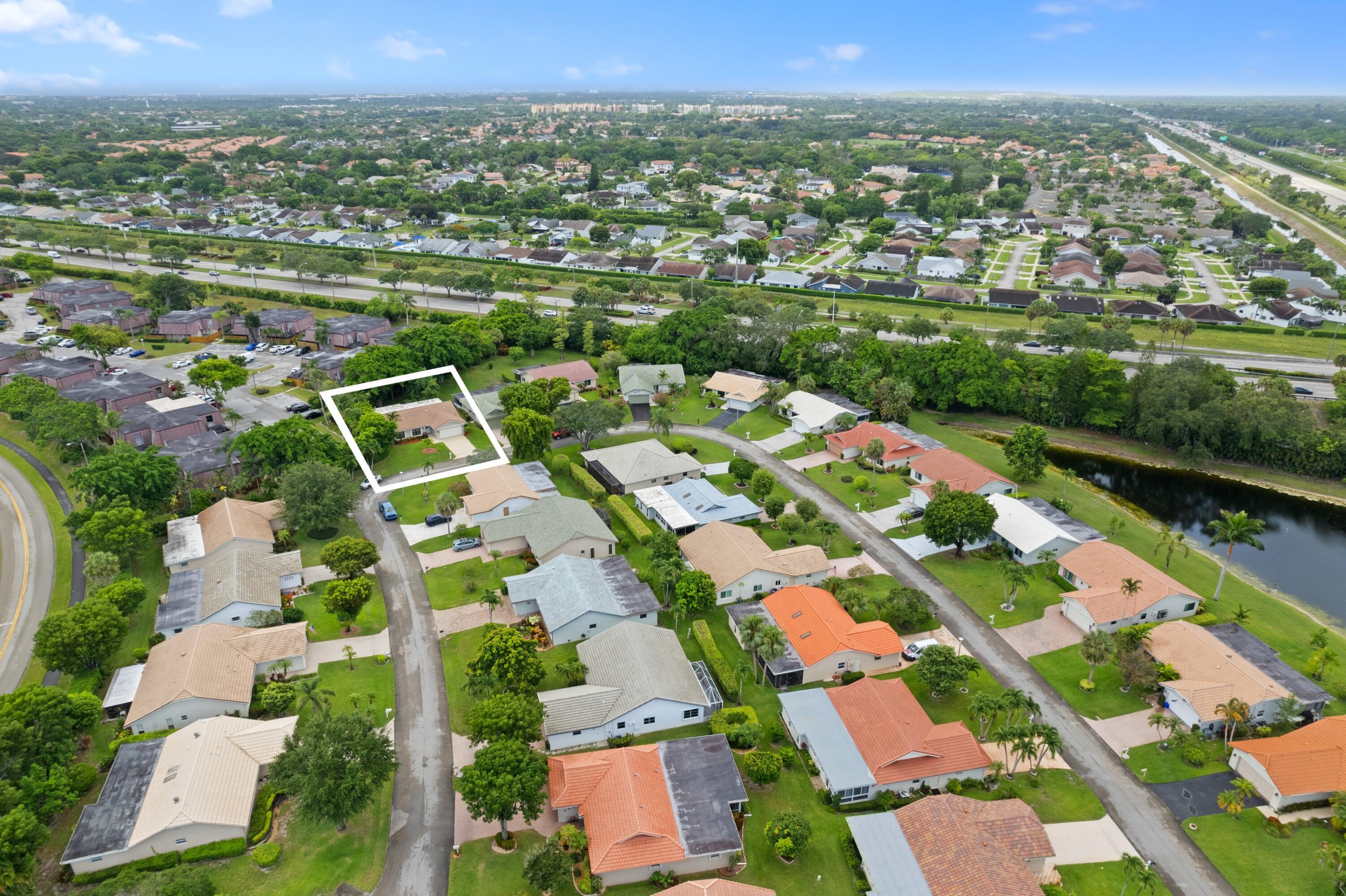 7980 Cloverfield Circle Boca Raton, FL 33433 - Photo 30 of 44 an aerial view of multiple house