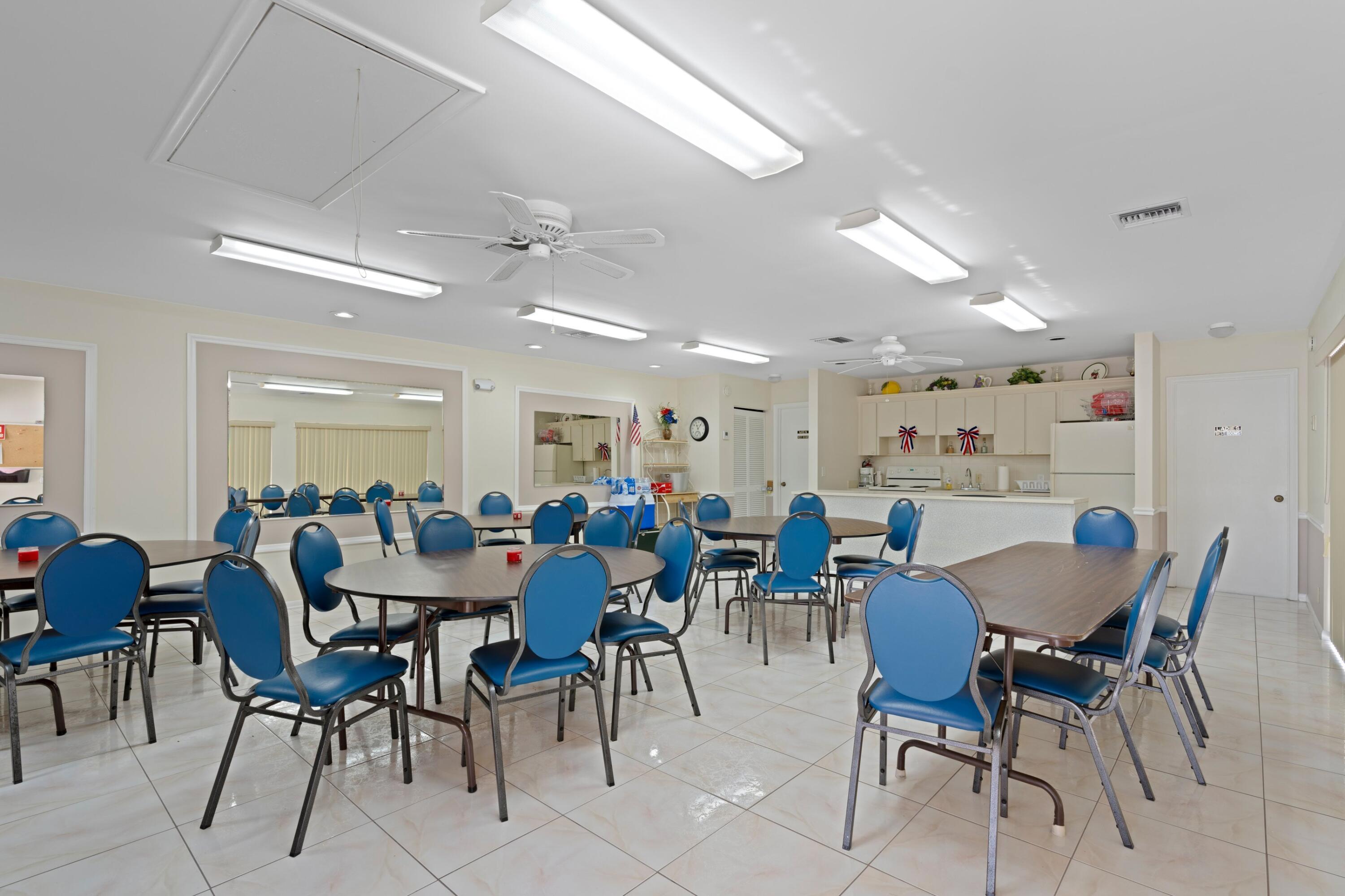7980 Cloverfield Circle Boca Raton, FL 33433 - Photo 31 of 44 a view of a dining area with furniture