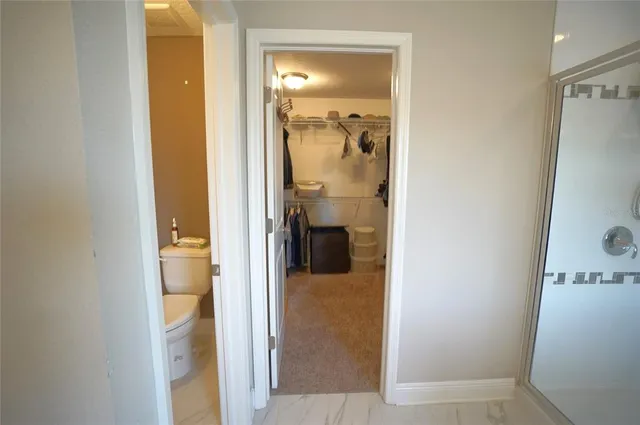 a view of a bedroom from a hallway