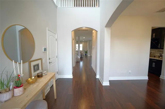 a view of a livingroom with furniture hardwood floor and a living room