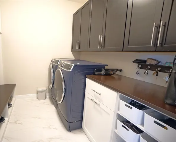 a utility room with cabinets
