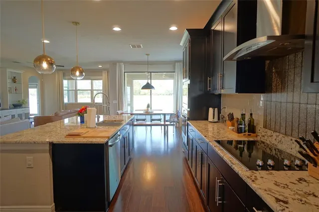 a kitchen with kitchen island granite countertop lots of counter top space