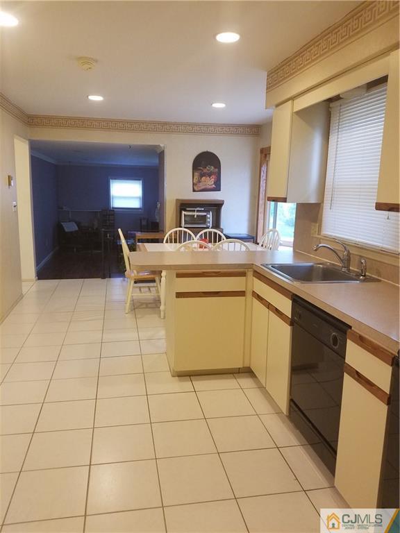 7 Stradford Road Sayreville, NJ 08859 - Photo 11 of 25 a kitchen with stainless steel appliances granite countertop a sink and cabinets