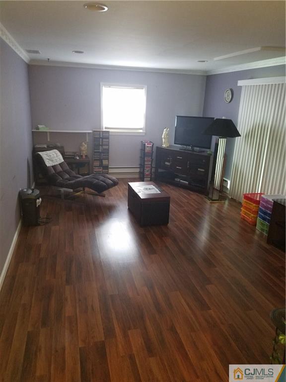 7 Stradford Road Sayreville, NJ 08859 - Photo 12 of 25 a living room with furniture and wooden floor