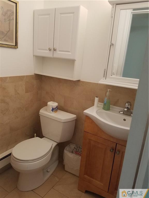 7 Stradford Road Sayreville, NJ 08859 - Photo 14 of 25 a bathroom with a sink toilet and mirror
