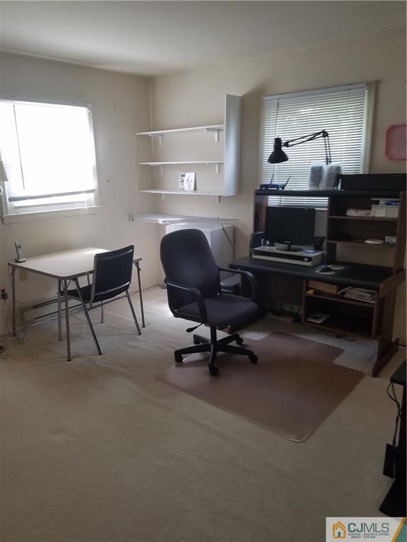 7 Stradford Road Sayreville, NJ 08859 - Photo 16 of 25 a living room with furniture a piano and a fireplace