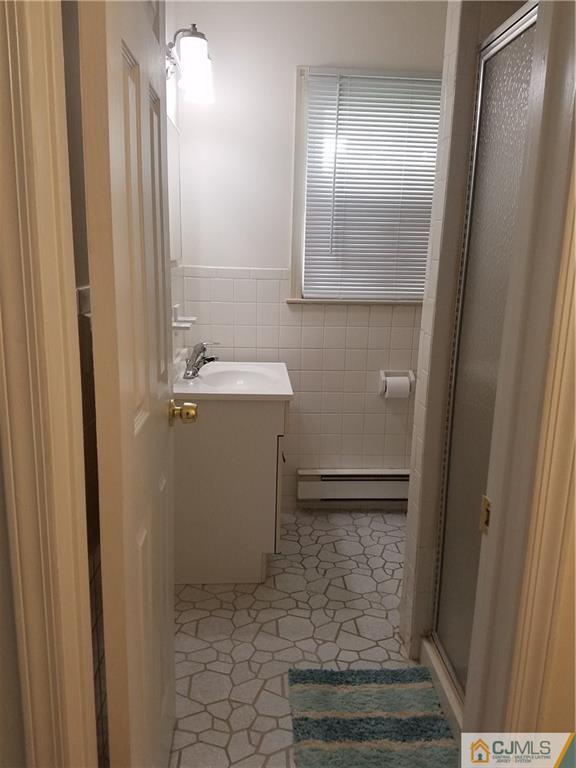 7 Stradford Road Sayreville, NJ 08859 - Photo 24 of 25 a bathroom with a sink a toilet and shower