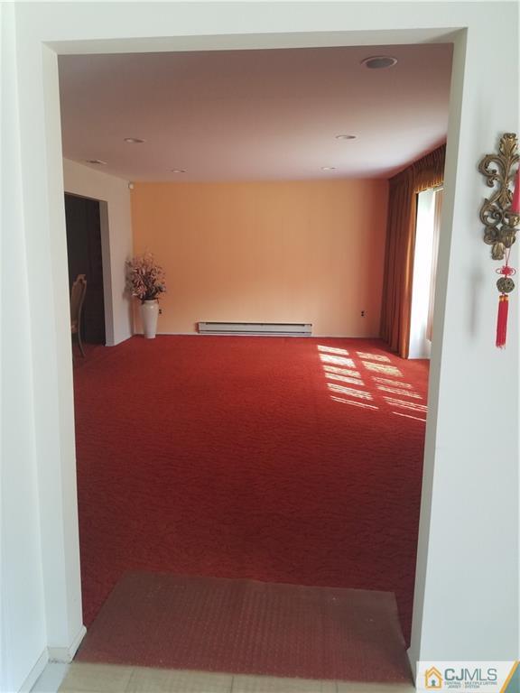 7 Stradford Road Sayreville, NJ 08859 - Photo 25 of 25 a view of an empty room with wooden floor and a window