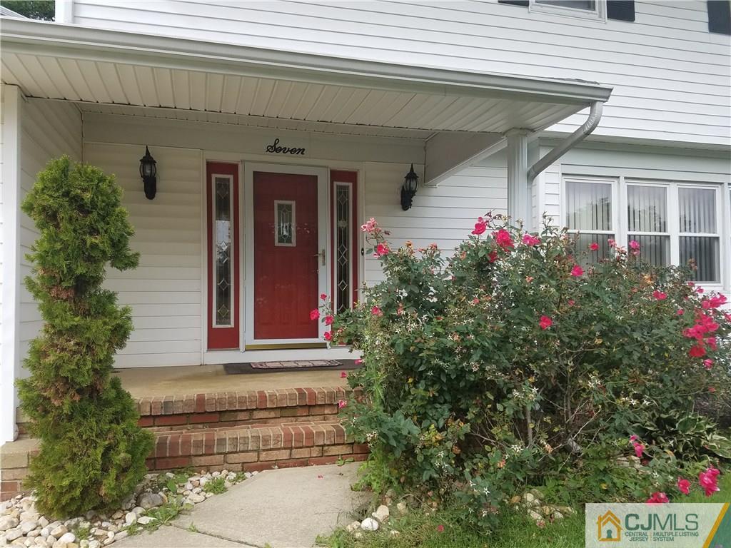 7 Stradford Road Sayreville, NJ 08859 - Photo 4 of 25 a front view of a house with plants