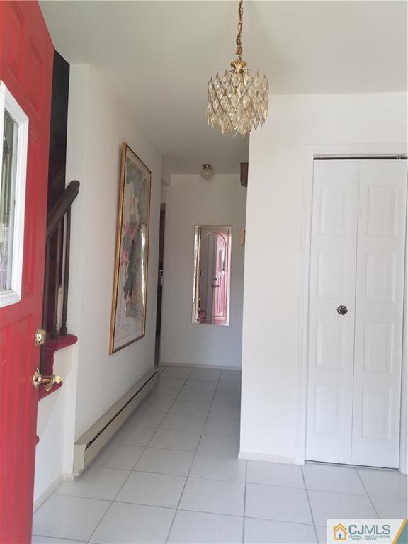 7 Stradford Road Sayreville, NJ 08859 - Photo 5 of 25 a view of entryway with chandelier